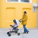 Mom with toddler in the award-winning Kolcraft Cloud Plus stroller Thumbnail