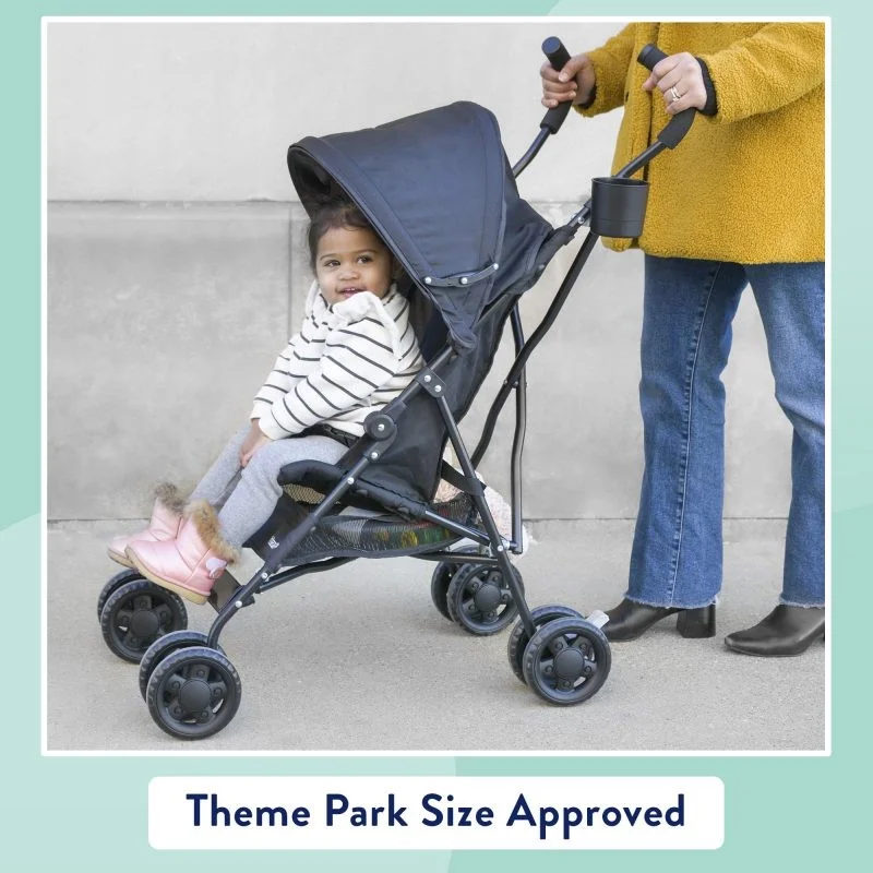 Toddler in kolcraft umbrella stroller