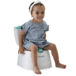 toddler girl sitting on the potty
