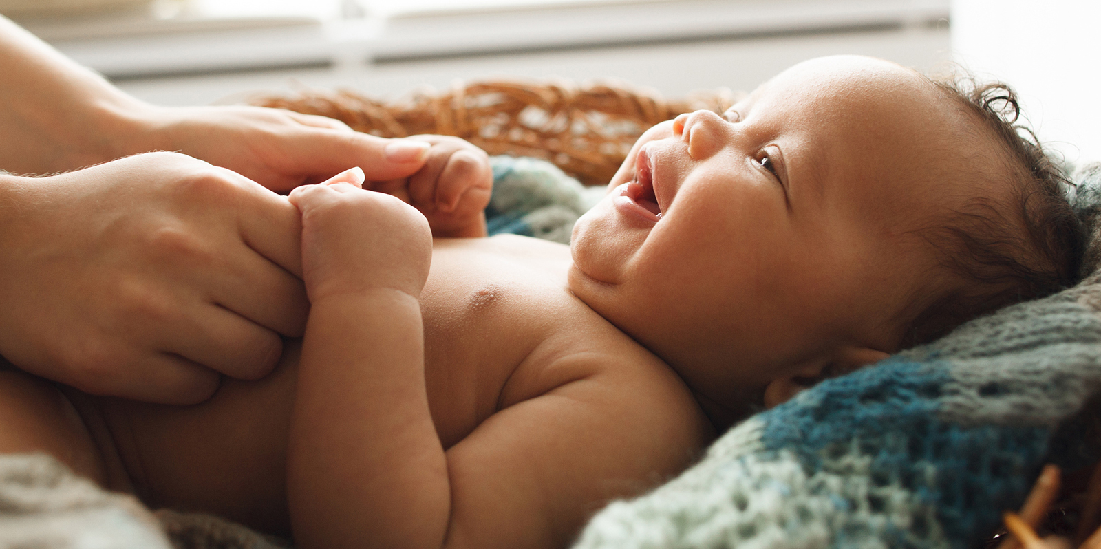 Baby smiling at mother, close-up