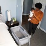 Kolcraft® Healthy Lite™ Portable Bassinet with Antimicrobial Sheet Protection - Gray/White Ditsy Triangle