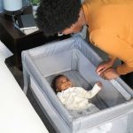 Kolcraft® Healthy Lite™ Portable Bassinet with Antimicrobial Sheet Protection - Gray/White Ditsy Triangle